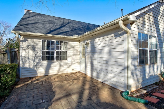113 Silverstone Rd, Lexington, SC 29072 - rear view of property featuring a shingled roof, fence, and a patio area