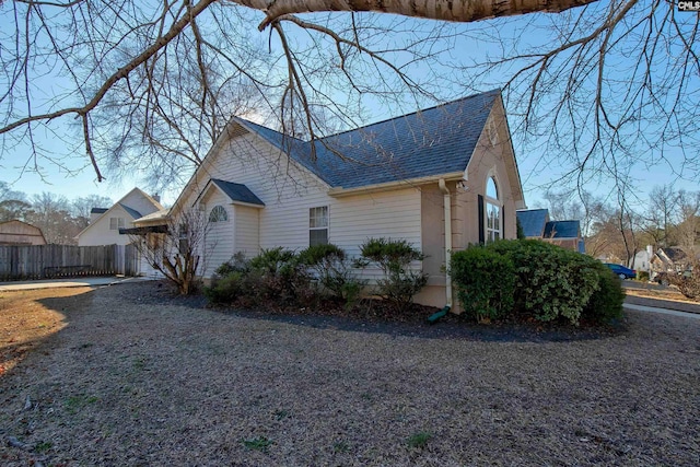 113 Silverstone Rd, Lexington, SC 29072 - view of property exterior featuring a shingled roof and fence