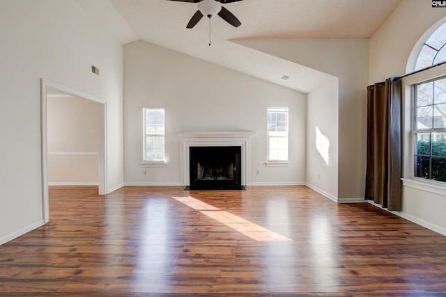 113 Silverstone Rd, Lexington, SC 29072 - unfurnished living room with a fireplace with flush hearth, visible vents, ceiling fan, and wood finished floors