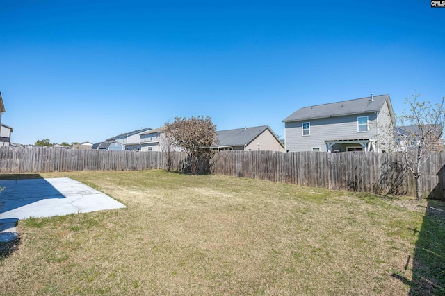 view of yard featuring a fenced backyard and a patio