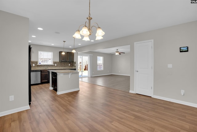kitchen with dishwasher, open floor plan, plenty of natural light, and tasteful backsplash