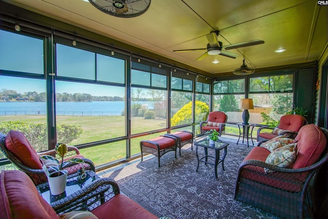 sunroom / solarium featuring a water view, outdoor lounge area, and ceiling fan