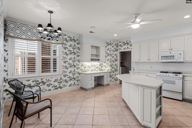 kitchen with white appliances, wallpapered walls, light countertops, and open shelves