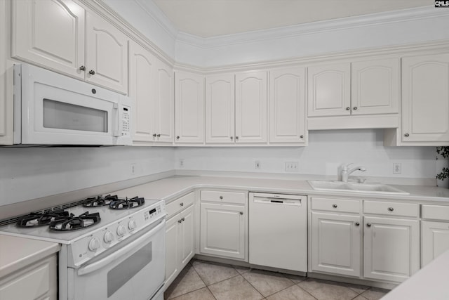 kitchen with white cabinetry, a sink, light countertops, and white appliances