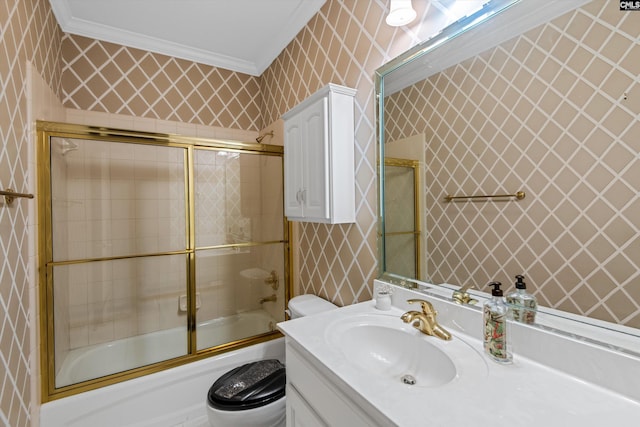 bathroom featuring wallpapered walls, toilet, combined bath / shower with glass door, and crown molding