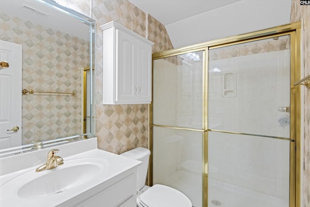bathroom with a shower stall, visible vents, toilet, and vanity