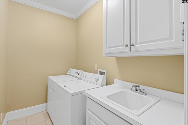 clothes washing area with washing machine and clothes dryer, crown molding, a sink, cabinet space, and light tile patterned floors