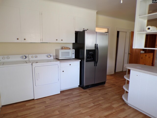 302 Baskin Ave, Bishopville, SC 29010 - laundry room with light wood-style floors, crown molding, washer and dryer, and laundry area
