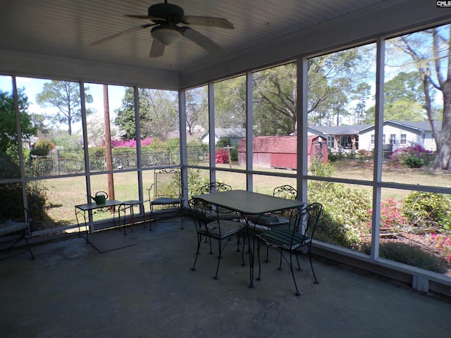 302 Baskin Ave, Bishopville, SC 29010 - unfurnished sunroom with a ceiling fan and outdoor dining space