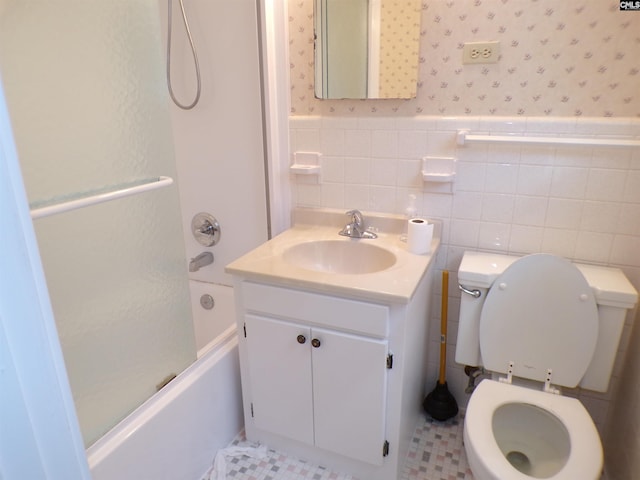 302 Baskin Ave, Bishopville, SC 29010 - full bath featuring vanity, toilet, bathtub / shower combination, wallpapered walls, and a wainscoted wall