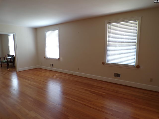 302 Baskin Ave, Bishopville, SC 29010 - spare room featuring baseboards, visible vents, and light wood-style floors