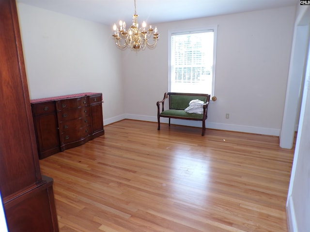 302 Baskin Ave, Bishopville, SC 29010 - living area with a chandelier, baseboards, and light wood finished floors