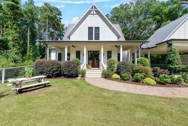 178 Pomaria St, Little Mountain, SC 29075 - view of front facade with metal roof, ceiling fan, a porch, and a front yard