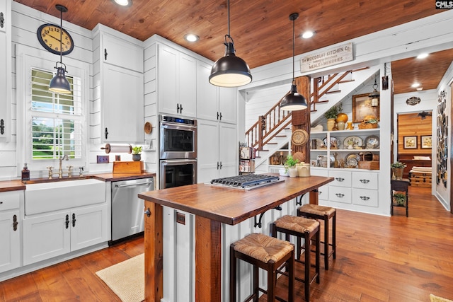 178 Pomaria St, Little Mountain, SC 29075 - kitchen with wood counters, a sink, wooden ceiling, and appliances with stainless steel finishes