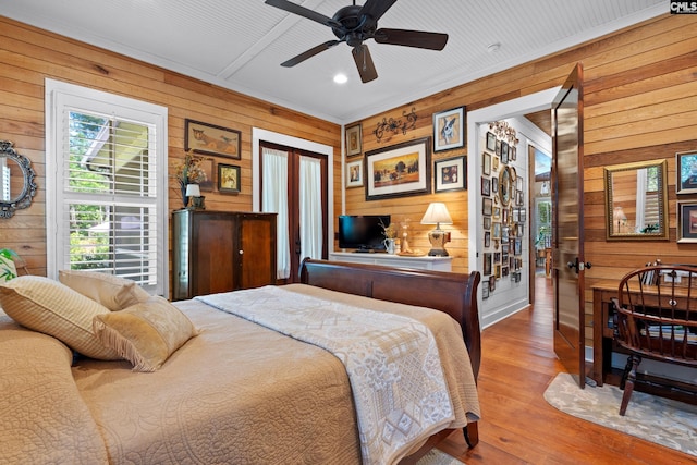 178 Pomaria St, Little Mountain, SC 29075 - bedroom with wooden walls, ceiling fan, and wood finished floors