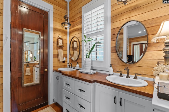 178 Pomaria St, Little Mountain, SC 29075 - bathroom featuring double vanity, a sink, and wooden walls