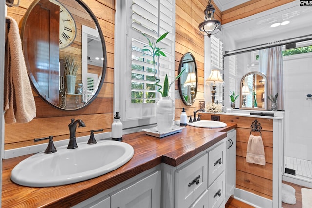 178 Pomaria St, Little Mountain, SC 29075 - full bath featuring double vanity, wooden walls, tiled shower, and a sink