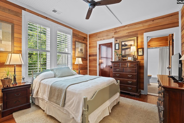 178 Pomaria St, Little Mountain, SC 29075 - bedroom featuring light wood-style flooring, wood walls, and visible vents