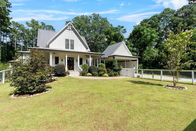 178 Pomaria St, Little Mountain, SC 29075 - modern farmhouse style home with a front yard, a gate, fence, metal roof, and a garage