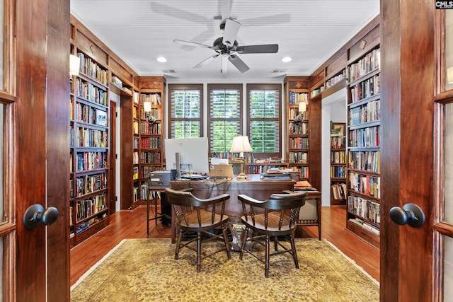 178 Pomaria St, Little Mountain, SC 29075 - home office with hardwood / wood-style flooring, ceiling fan, crown molding, and wall of books