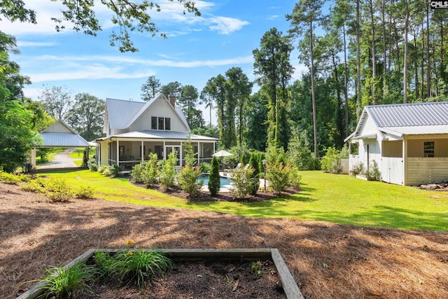 178 Pomaria St, Little Mountain, SC 29075 - view of yard with an outdoor pool and a sunroom