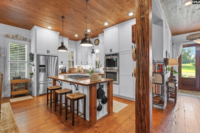 178 Pomaria St, Little Mountain, SC 29075 - kitchen with wood counters, light wood-style flooring, wood ceiling, and stainless steel appliances