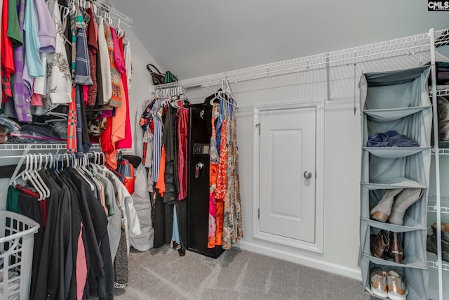 walk in closet featuring carpet floors