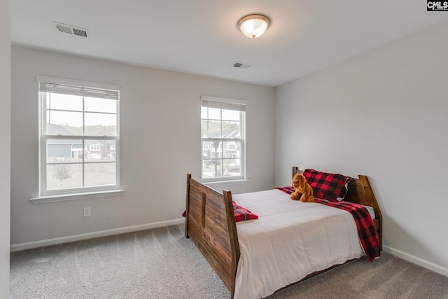 bedroom featuring carpet, baseboards, and visible vents