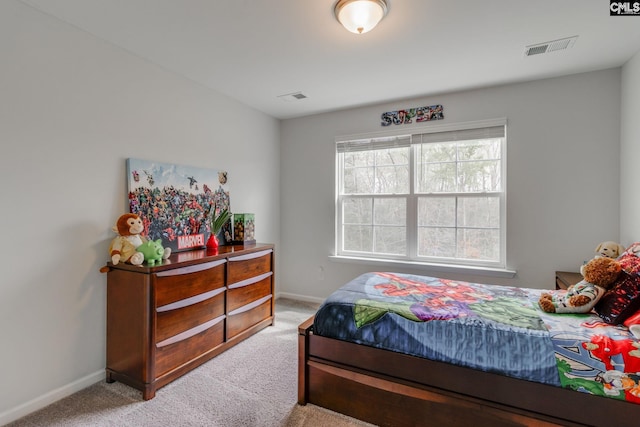 bedroom with baseboards, visible vents, and carpet floors