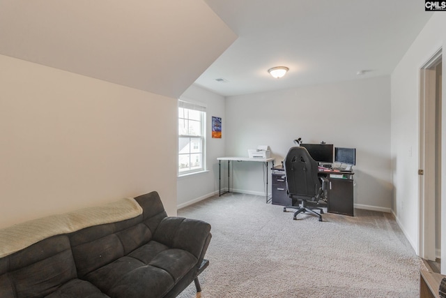 office space with baseboards, carpet flooring, and visible vents