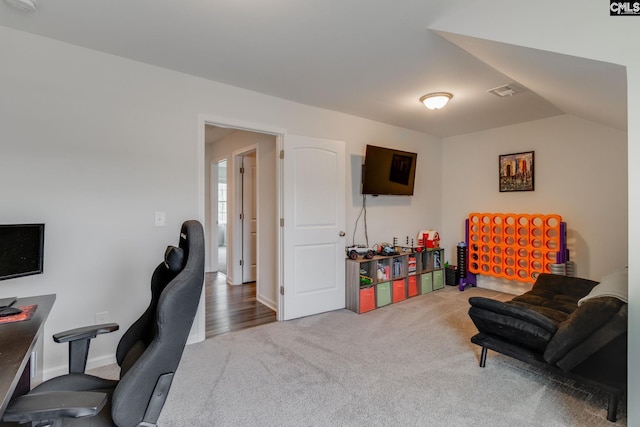 home office featuring visible vents and carpet