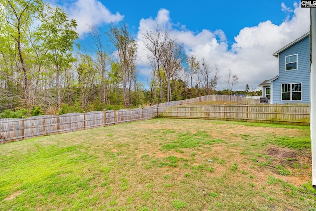 view of yard with a fenced backyard