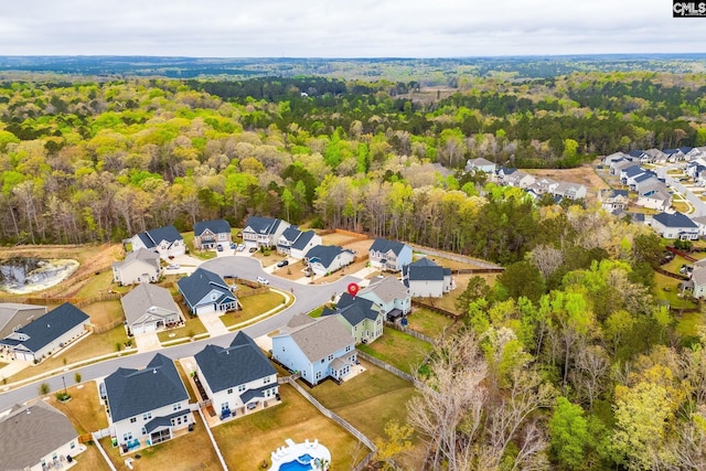 aerial view featuring a view of trees and a residential view