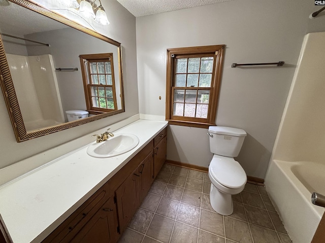 full bath with a textured ceiling, baseboards, toilet, vanity, and tile patterned flooring