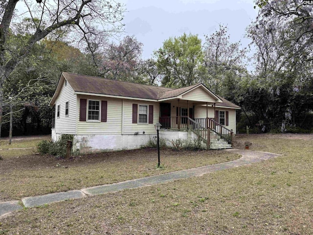 ranch-style house with crawl space, a front yard, and a porch