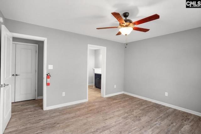 unfurnished bedroom featuring baseboards and light wood-style floors