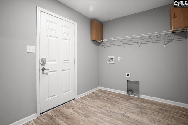 laundry room with light wood finished floors, washer hookup, baseboards, laundry area, and hookup for an electric dryer