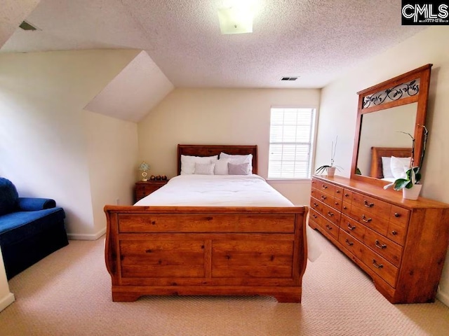 103 Saddlechase Ln, Columbia, SC 29223 - bedroom featuring light carpet, a textured ceiling, vaulted ceiling, and visible vents