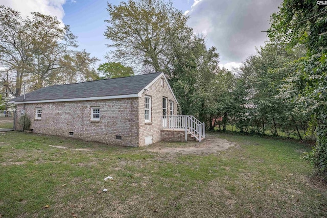 1565 Mayer St, Columbia, SC 29203 - view of home's exterior with brick siding, crawl space, and a yard