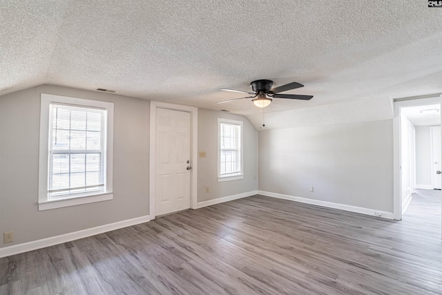 1565 Mayer St, Columbia, SC 29203 - interior space featuring vaulted ceiling, wood finished floors, baseboards, visible vents, and ceiling fan