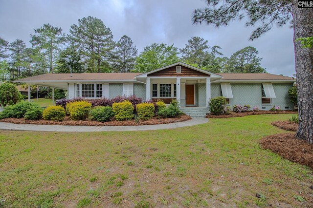 4437 Willingham Dr, Columbia, SC 29206 - ranch-style house with brick siding, a front lawn, and a carport