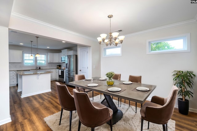 dining space featuring visible vents, crown molding, baseboards, dark wood-style floors, and an inviting chandelier