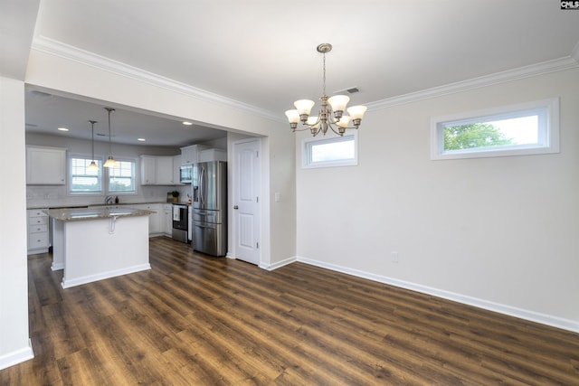 kitchen featuring a chandelier, baseboards, ornamental molding, stainless steel appliances, and dark wood-type flooring