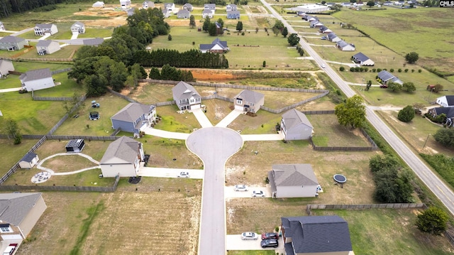 birds eye view of property with a rural view and a residential view