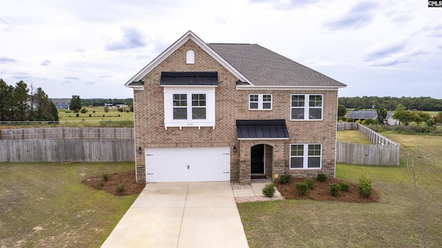 view of front of home with concrete driveway, a standing seam roof, fence, a front yard, and brick siding
