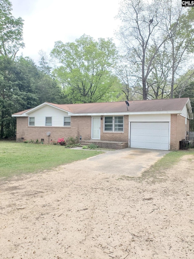 single story home featuring an attached garage, concrete driveway, a front yard, and brick siding