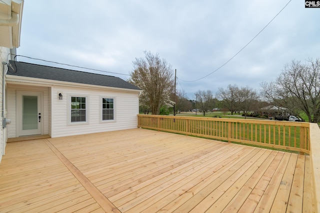 wooden deck with a yard