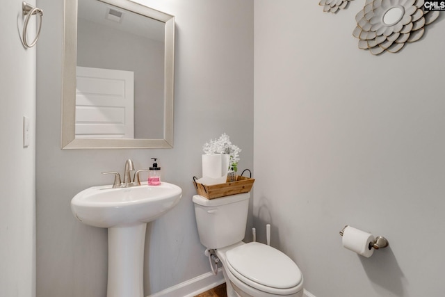 232 Compass Trl, Blythewood, SC 29016 - bathroom with a sink, visible vents, toilet, and baseboards