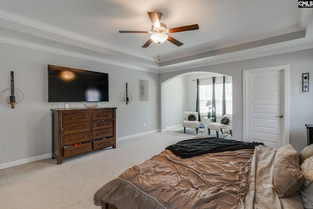 232 Compass Trl, Blythewood, SC 29016 - bedroom with baseboards, ornamental molding, light carpet, a tray ceiling, and arched walkways