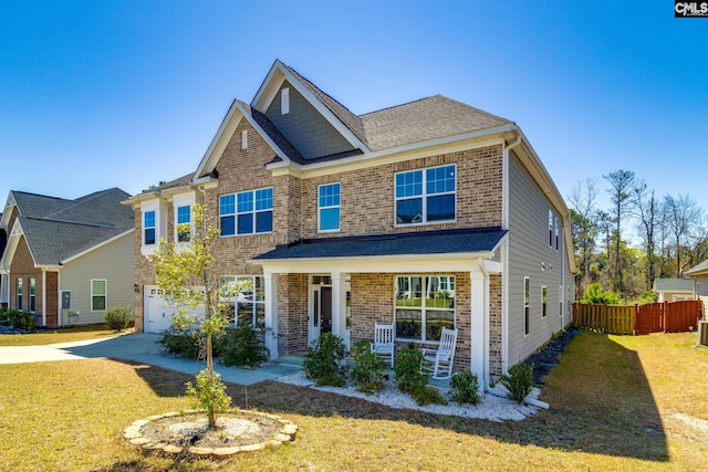 232 Compass Trl, Blythewood, SC 29016 - craftsman inspired home with concrete driveway, brick siding, fence, and a front lawn